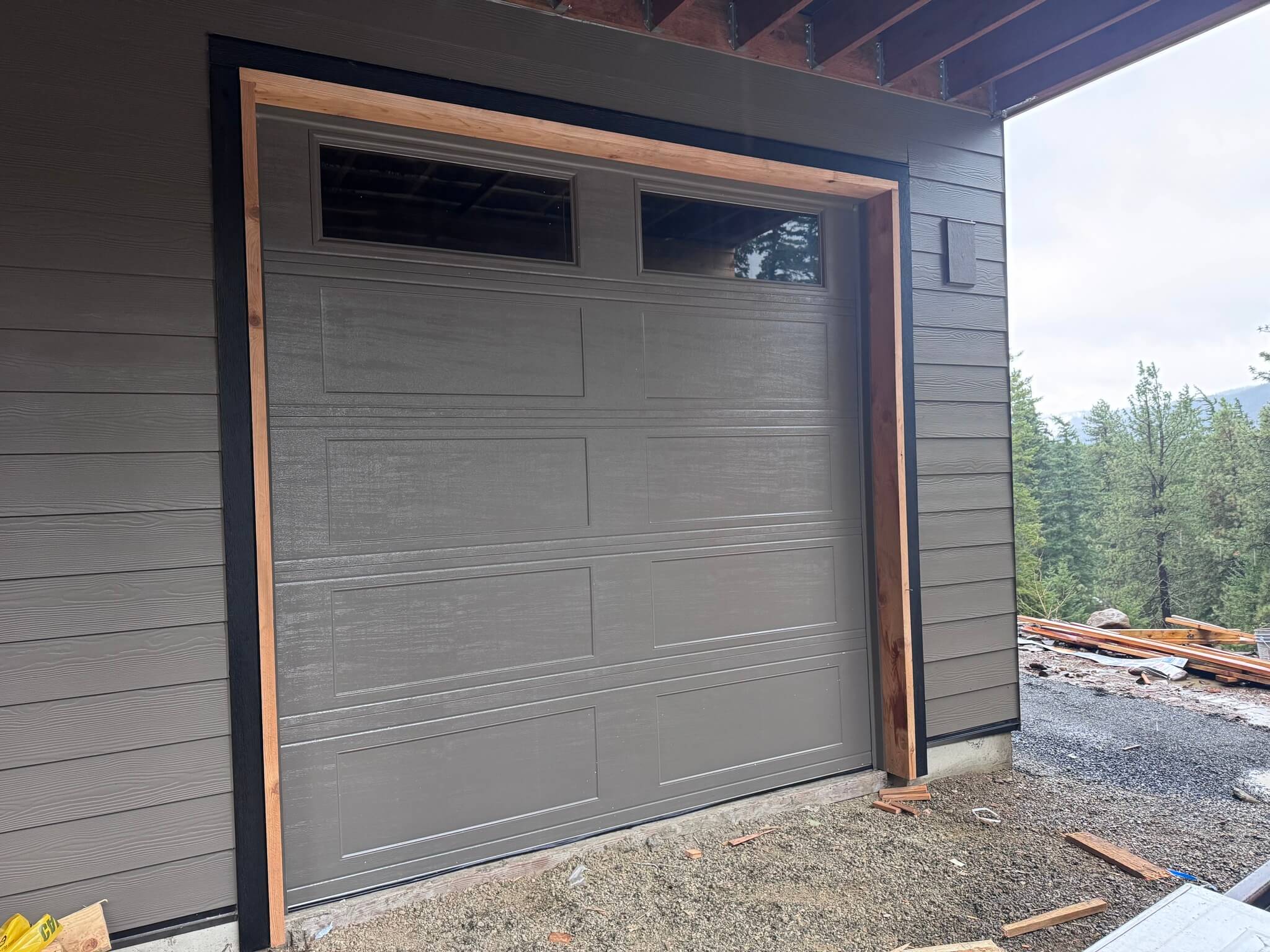 davis garage door install with haas garage door with excellent color matching to the home
