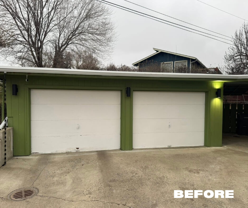 White garage door outside of a home. This is the before picture before the new installation.