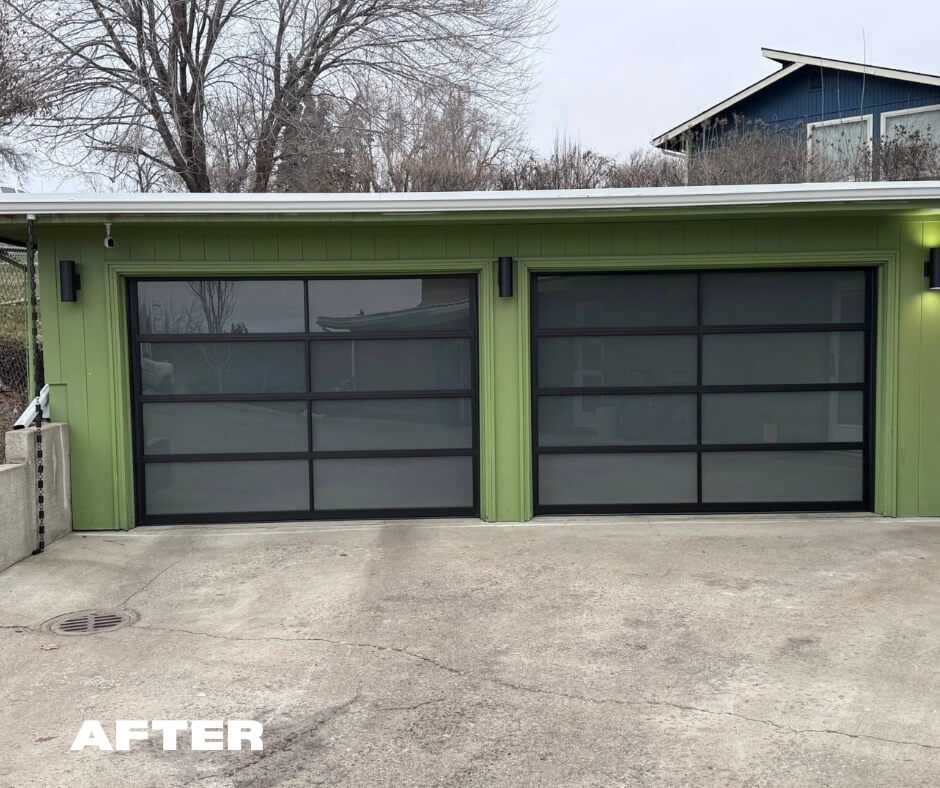 Black frame with windows garage door outside of a home. This is the new garage door installed by Davis Garage Doors