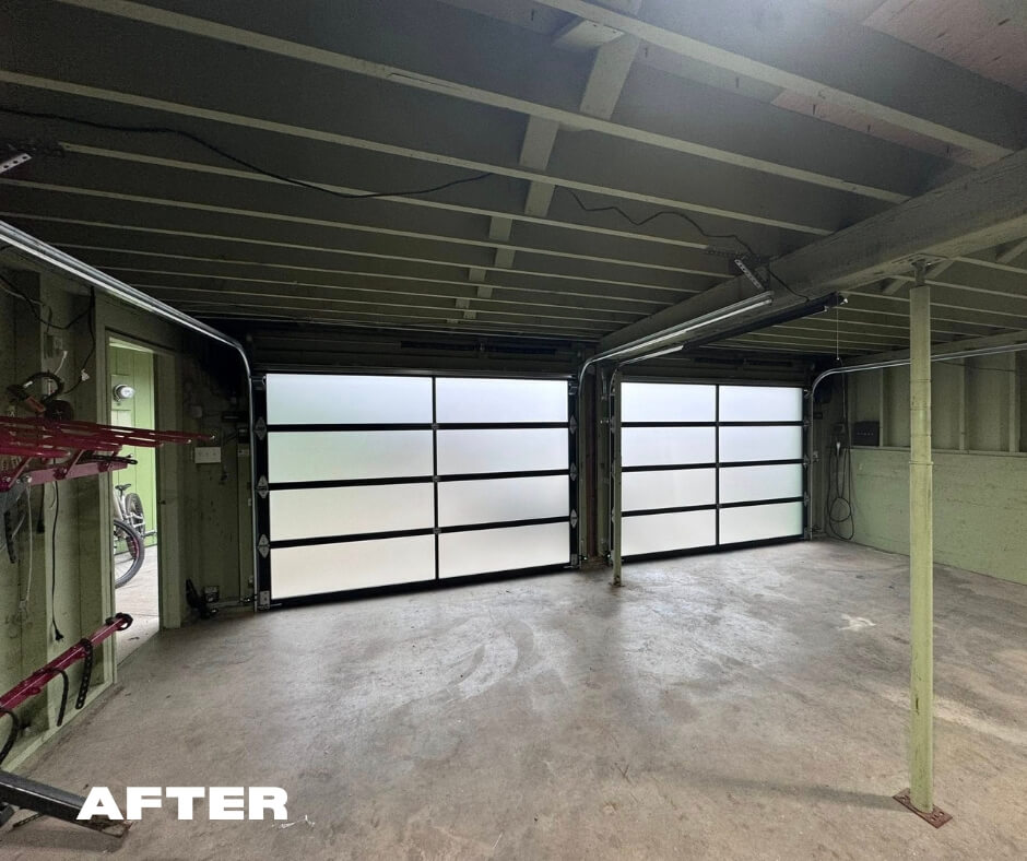 Black frame with windows garage door inside of the home. This is the new garage door installed by Davis Garage Doors