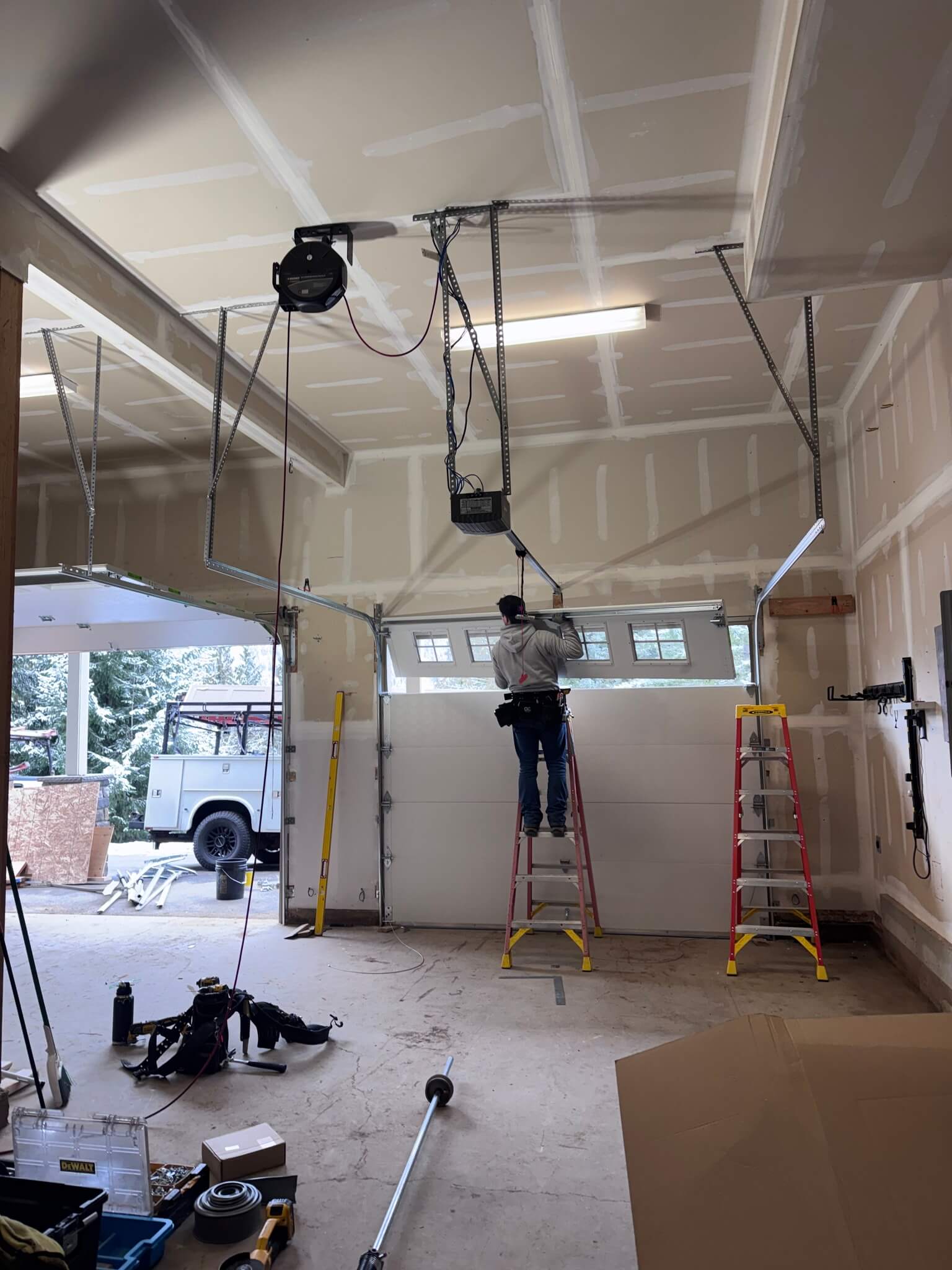 blaine working on the inside interior of a white garage door
