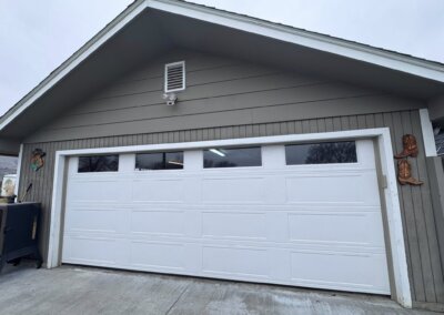 white double garage door with windows