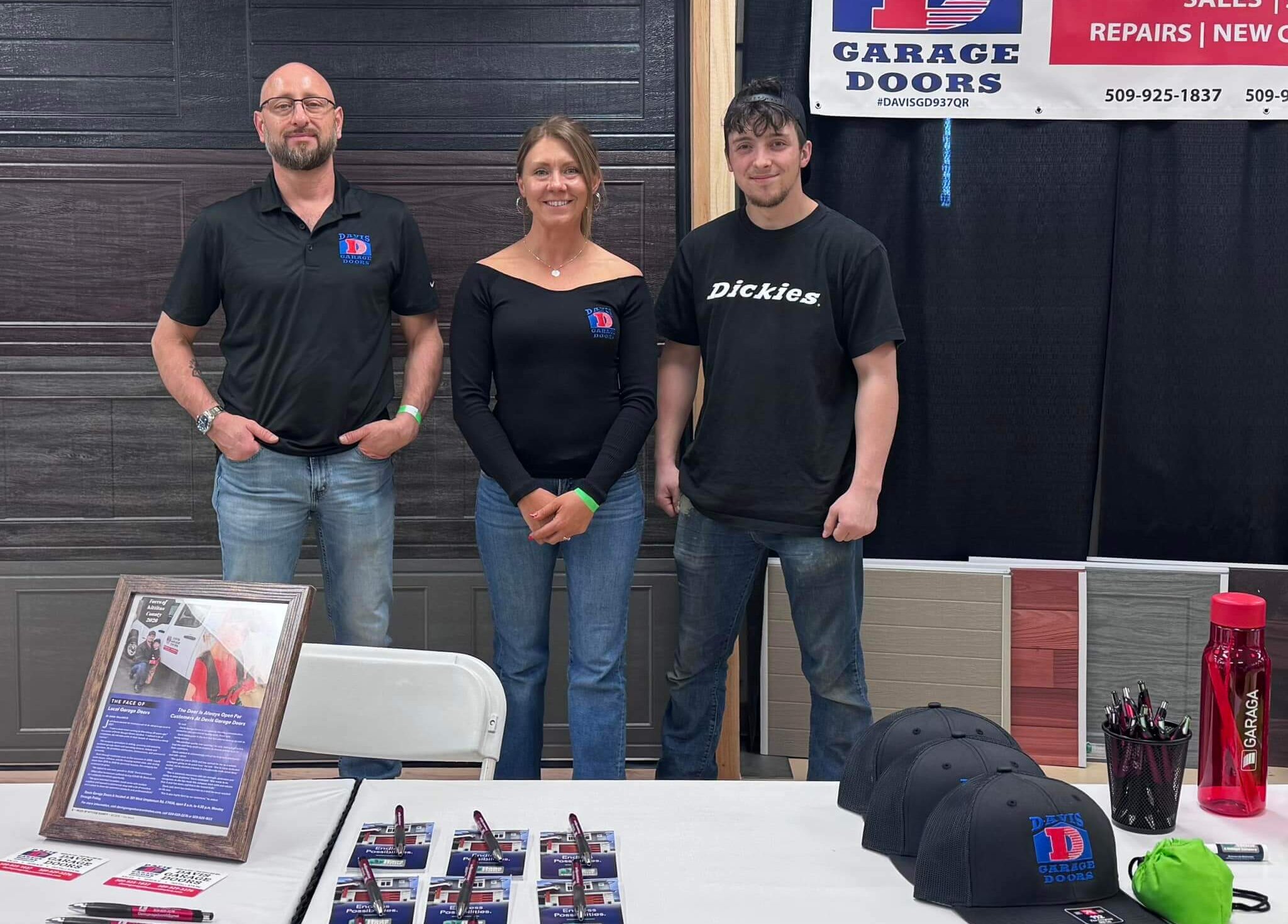 Josh, Jenni, and Blaine in front of their booth at the Home and Garden show