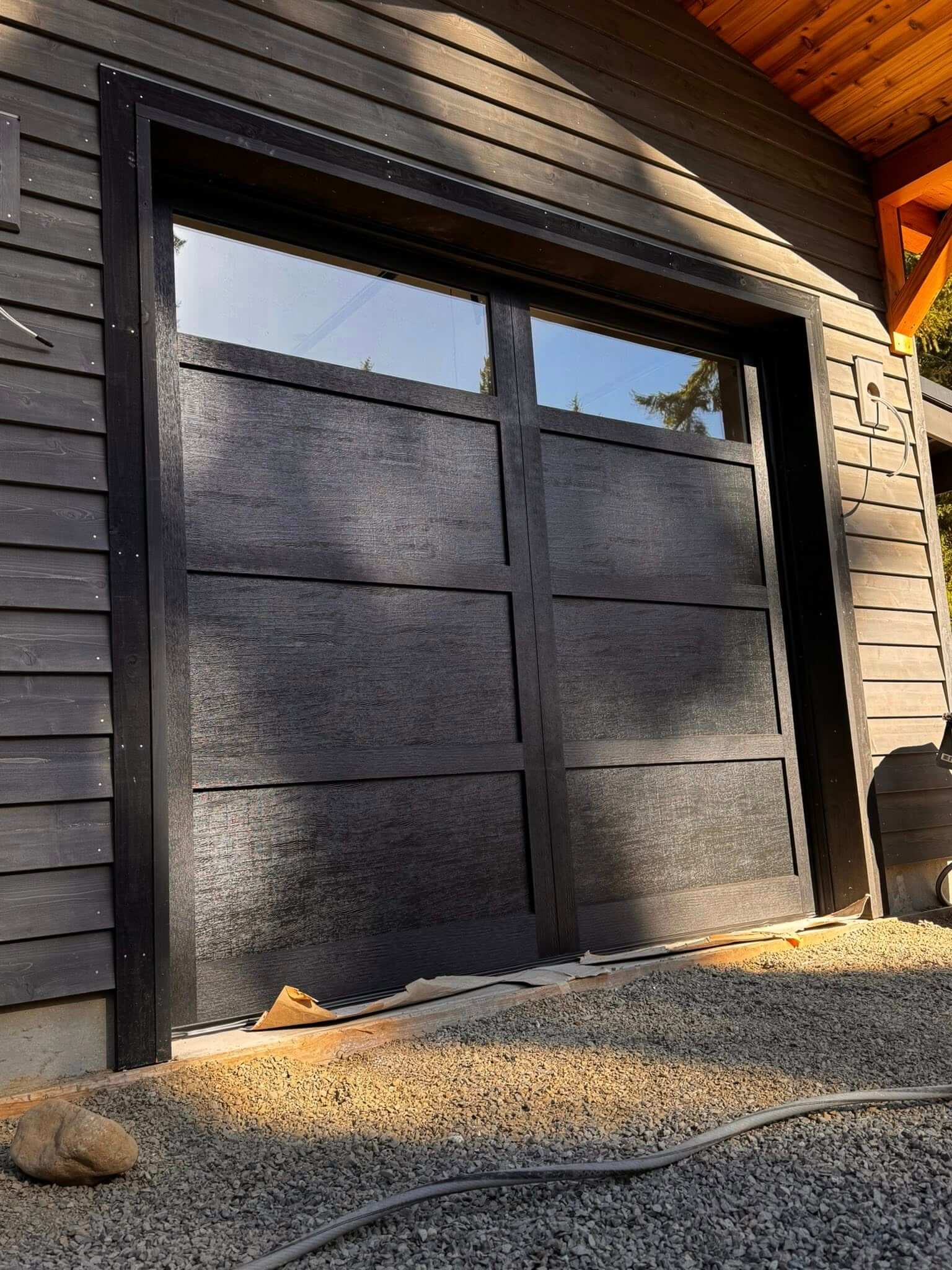 black house with black garage door