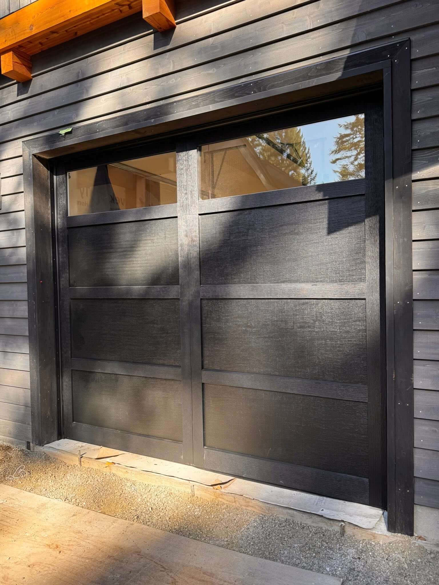 black house with black garage door