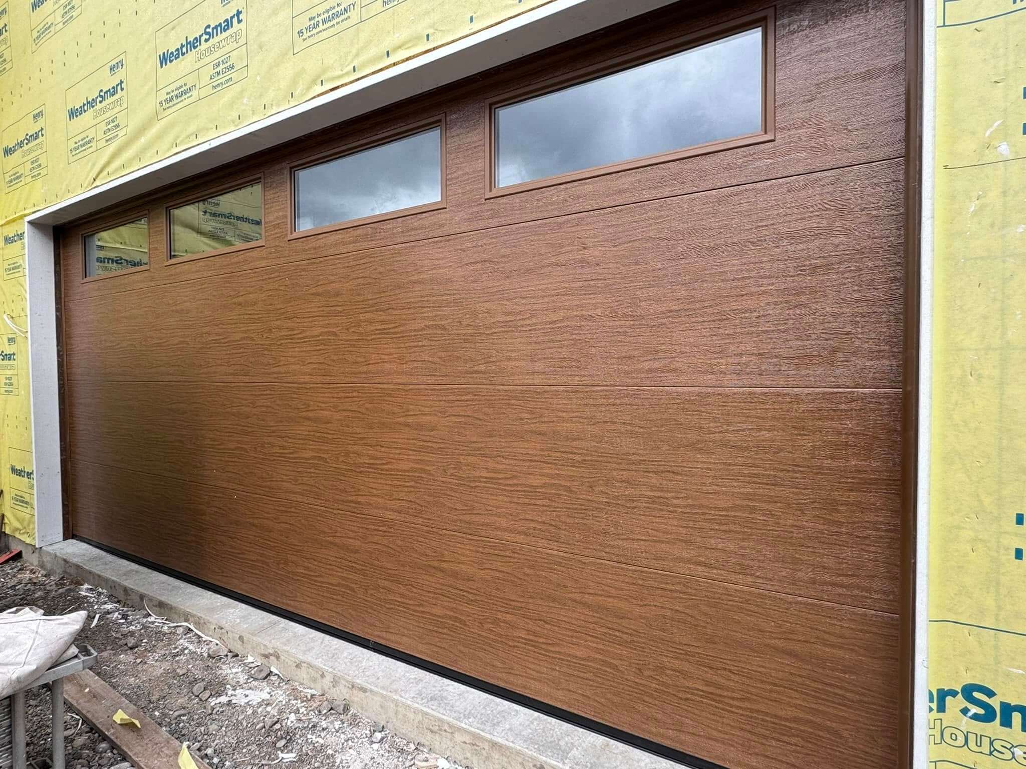 ash colored garage door with windows