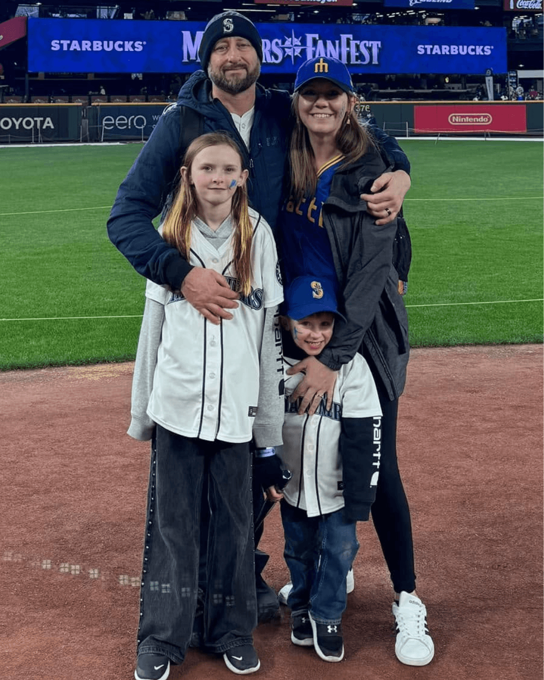 a family at a baseball field
